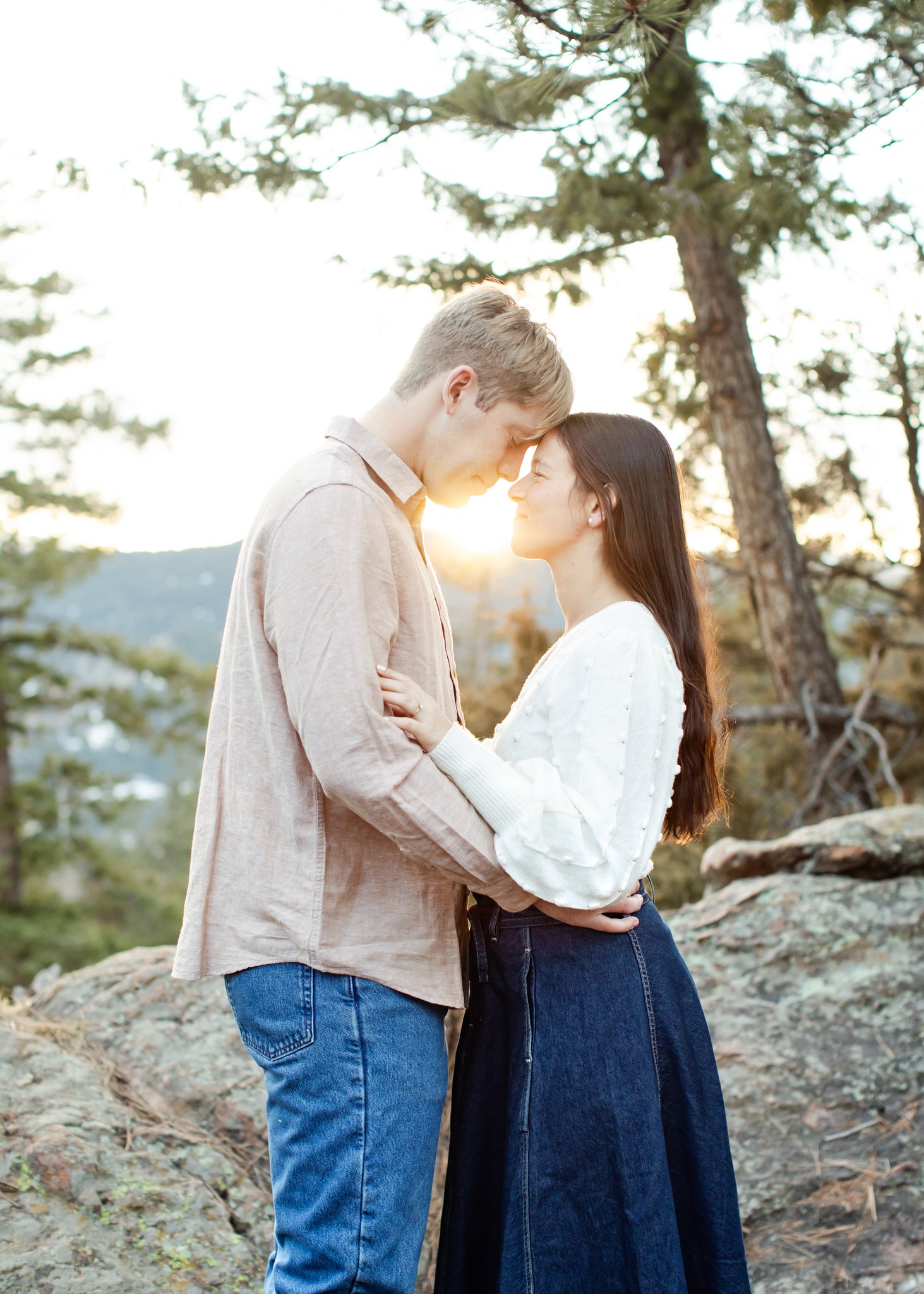 As the sun sets over the mountain peaks, Jonas and Julia embrace.