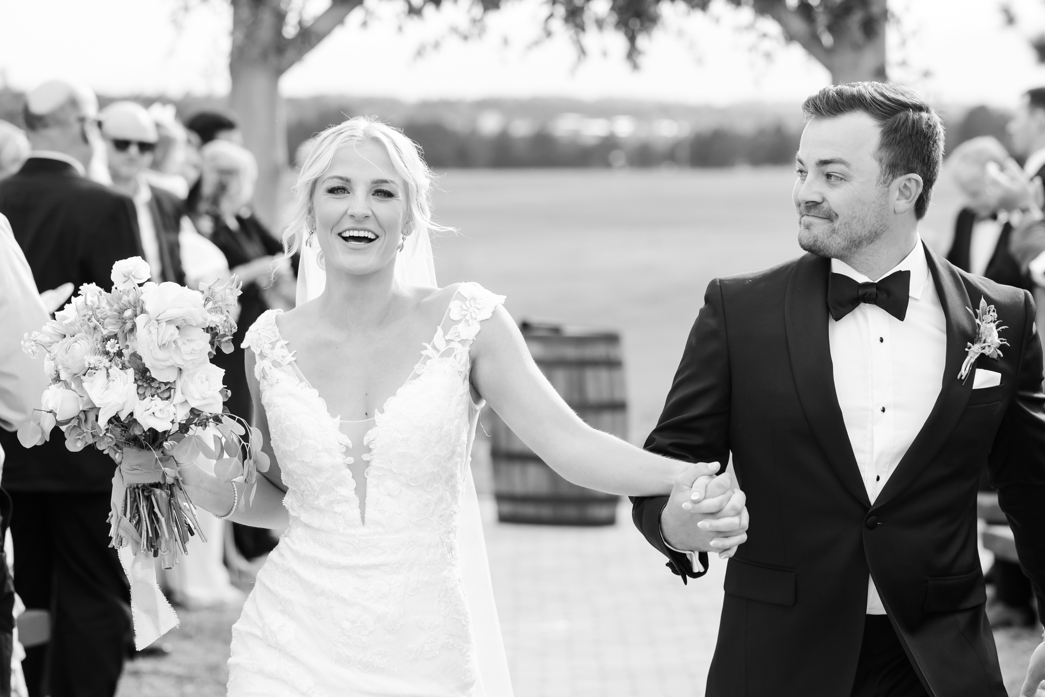 Nick and Lauren walking the aisle after their wedding ceremony at Younger Ranch.