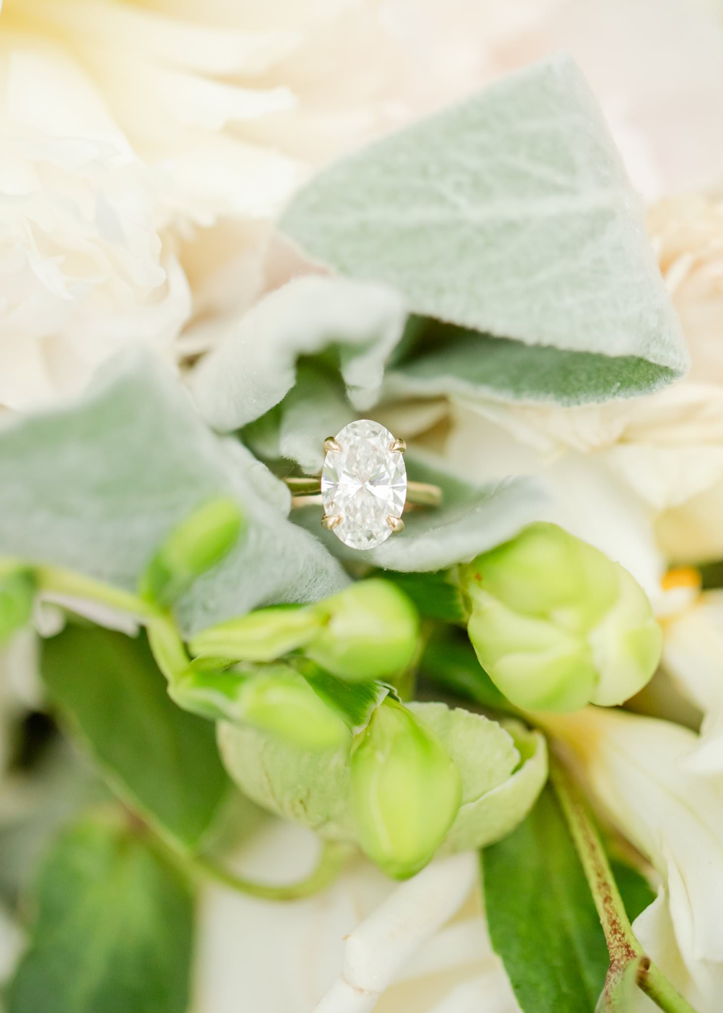 Real wedding ring in a bridal bouquet as an example of what's not an AI wedding photo.