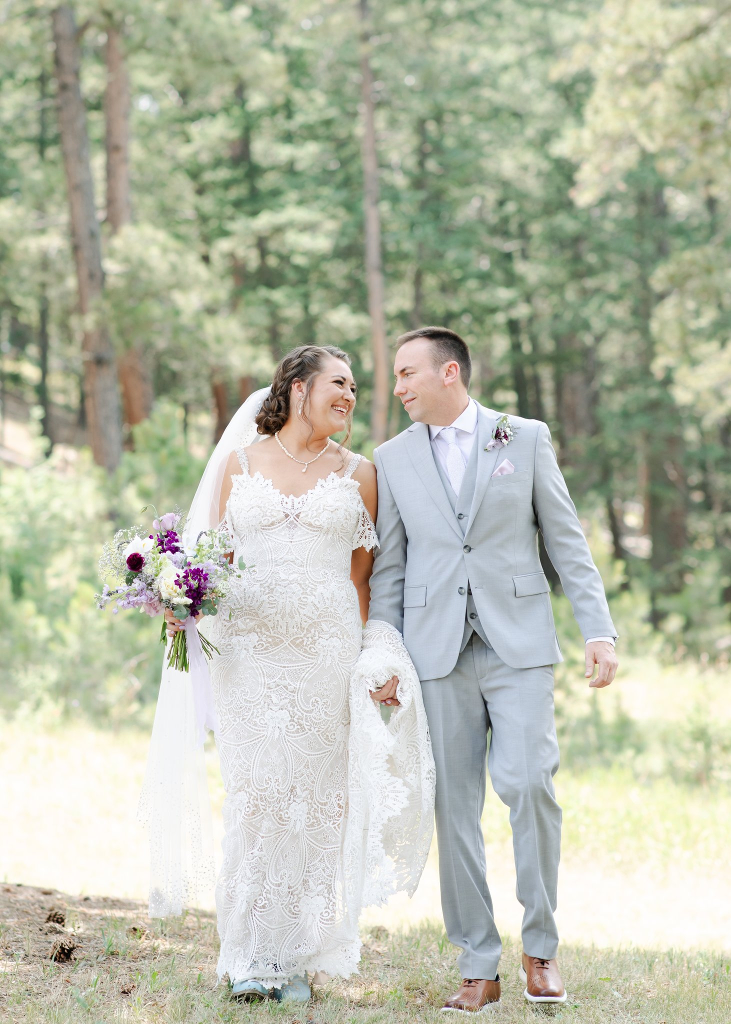 Bride and groom walking at Younger Ranch in a show of what doesn't look like an AI wedding photo.