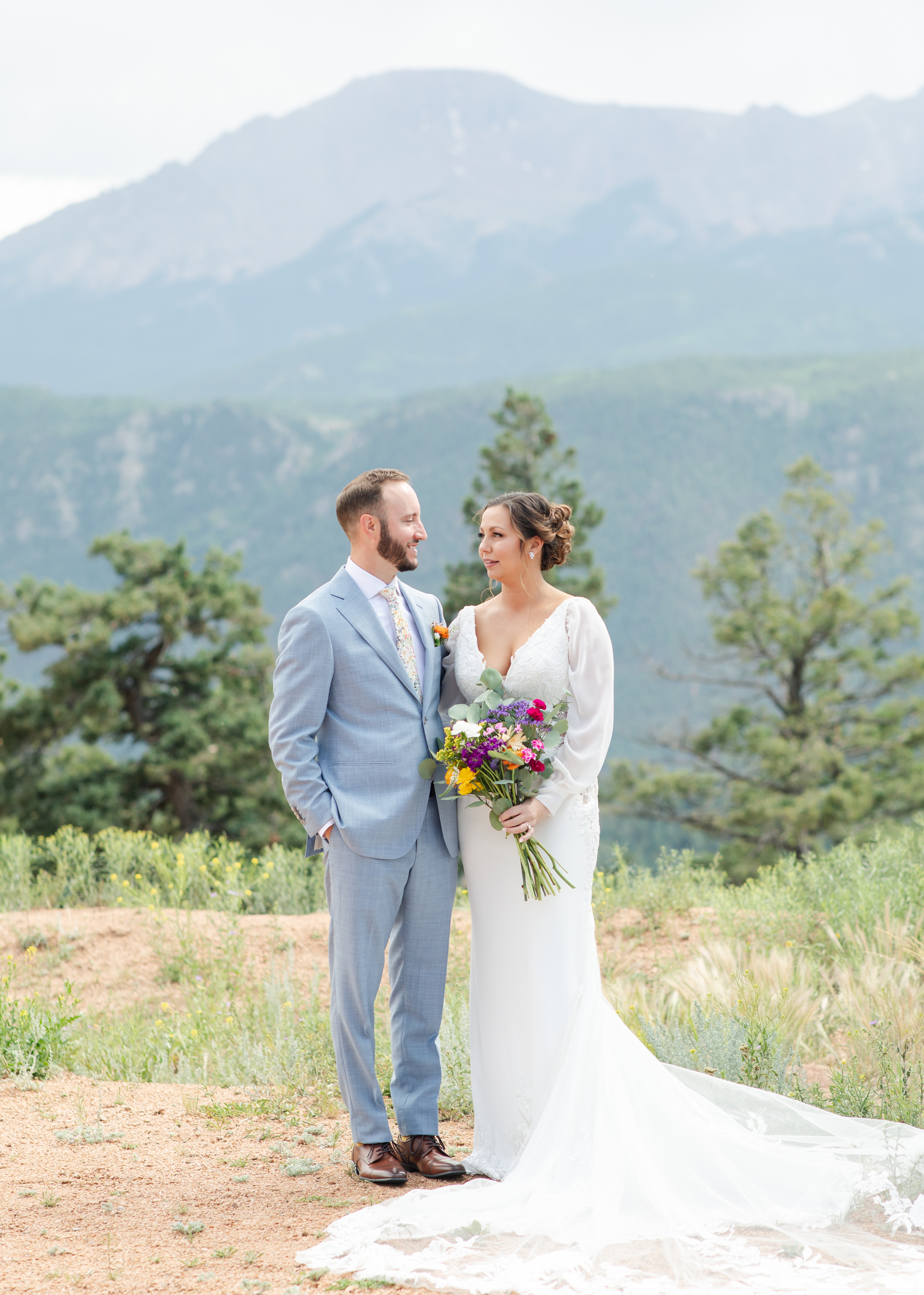 Bride and groom look at each other before their Mountain View wedding in Colorado Springs.