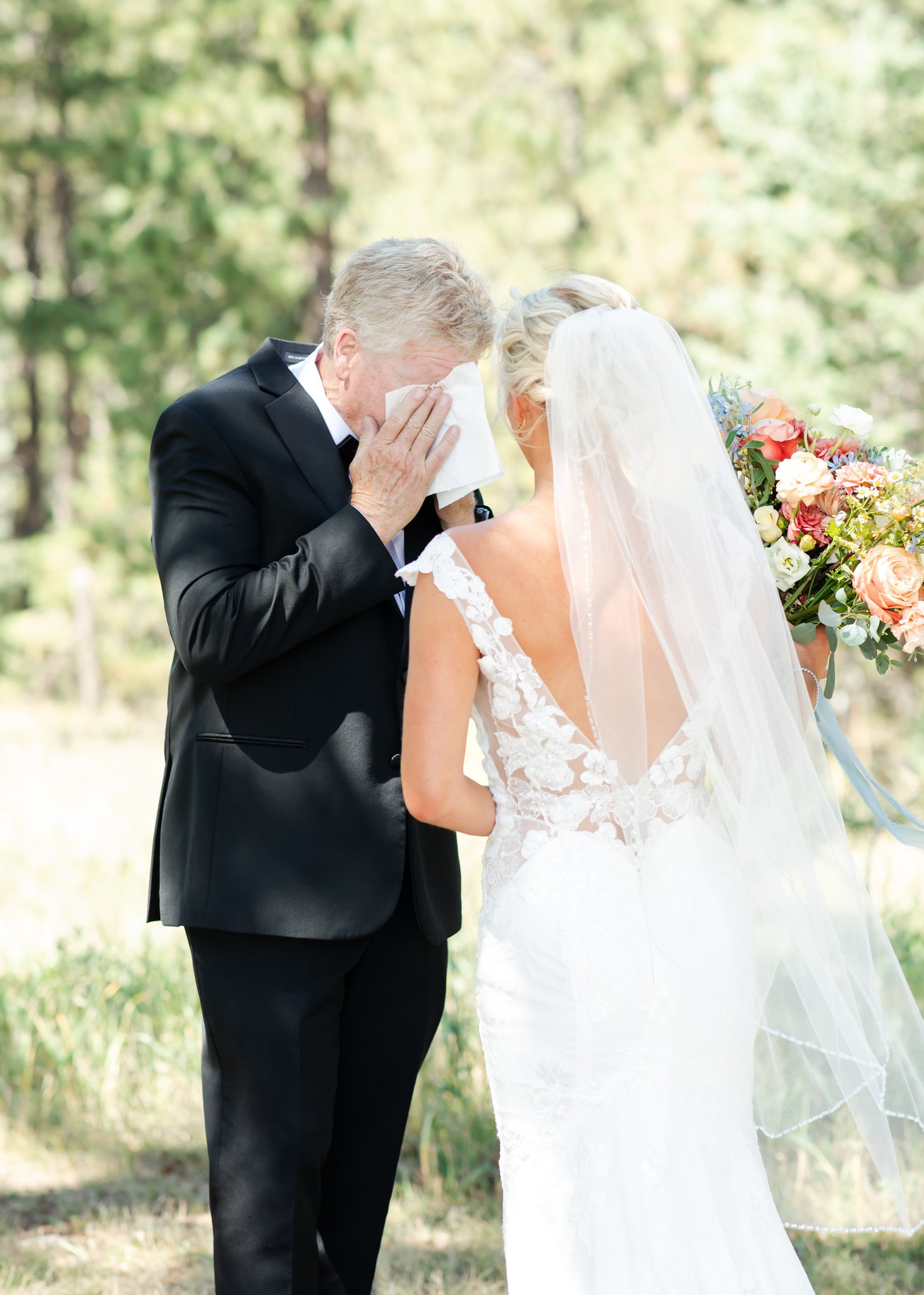 Father wipes his tears after seeing his daughter in her wedding dress for the first time at Denver wedding.