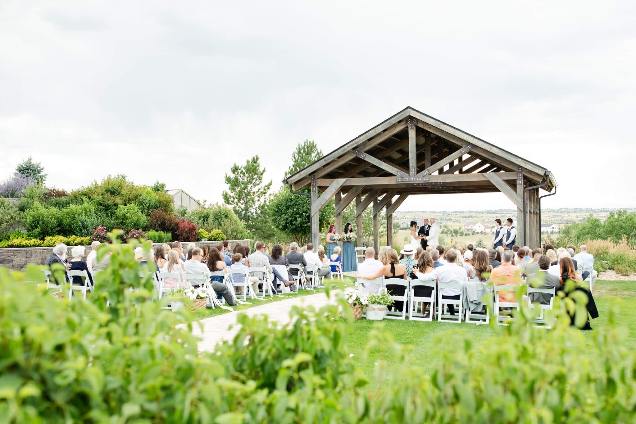 A look at an outdoor reception in the garden lawn at sunset