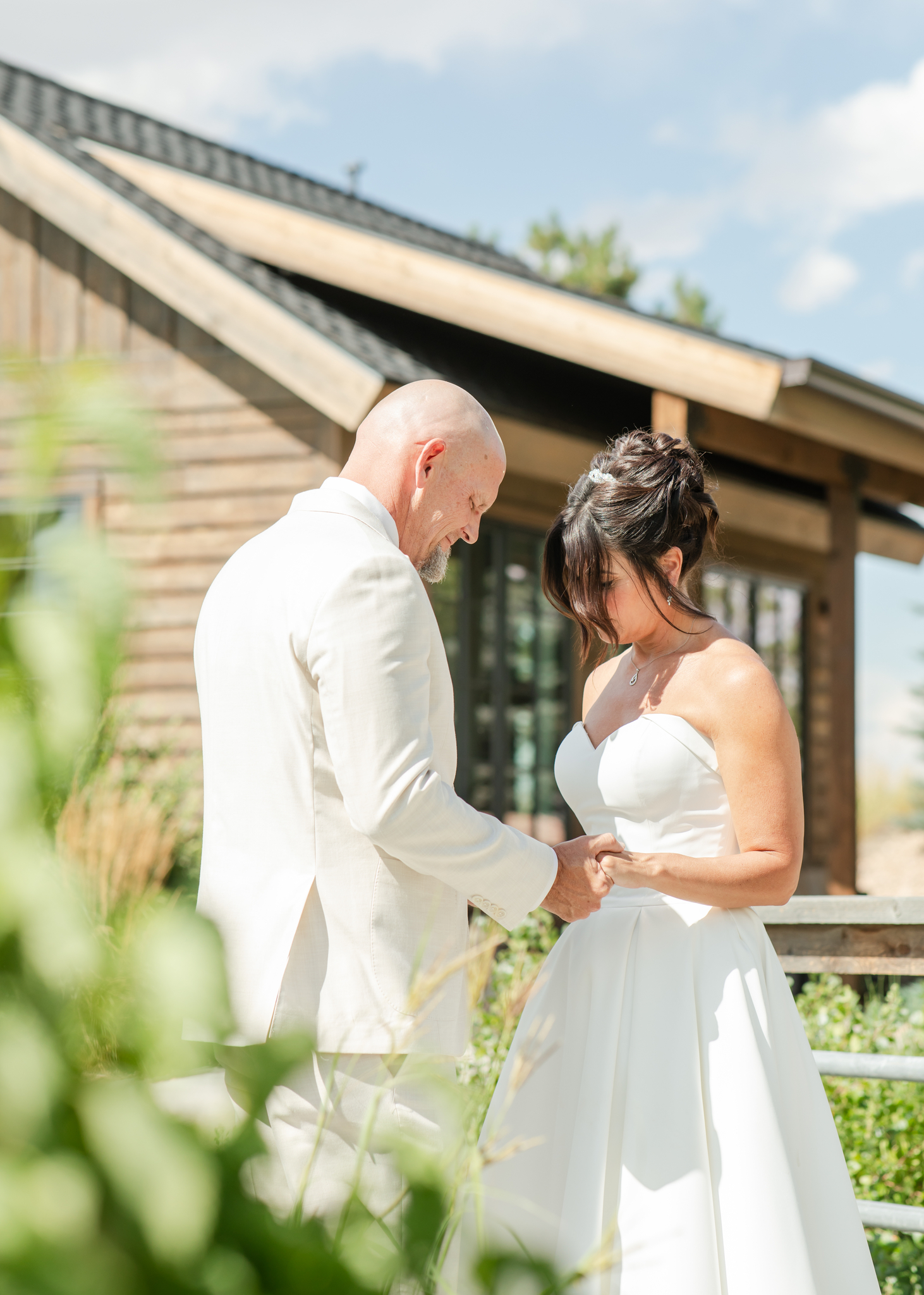 Newlyweds share a quiet first look in a garden thanks to planning by aspen gold events
